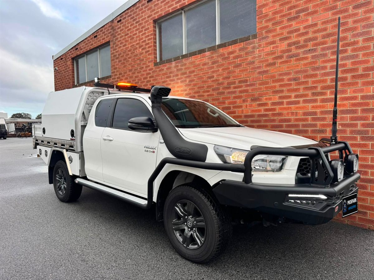 Hilux service body with amber beacon, snorkel, driving lights and UHF
