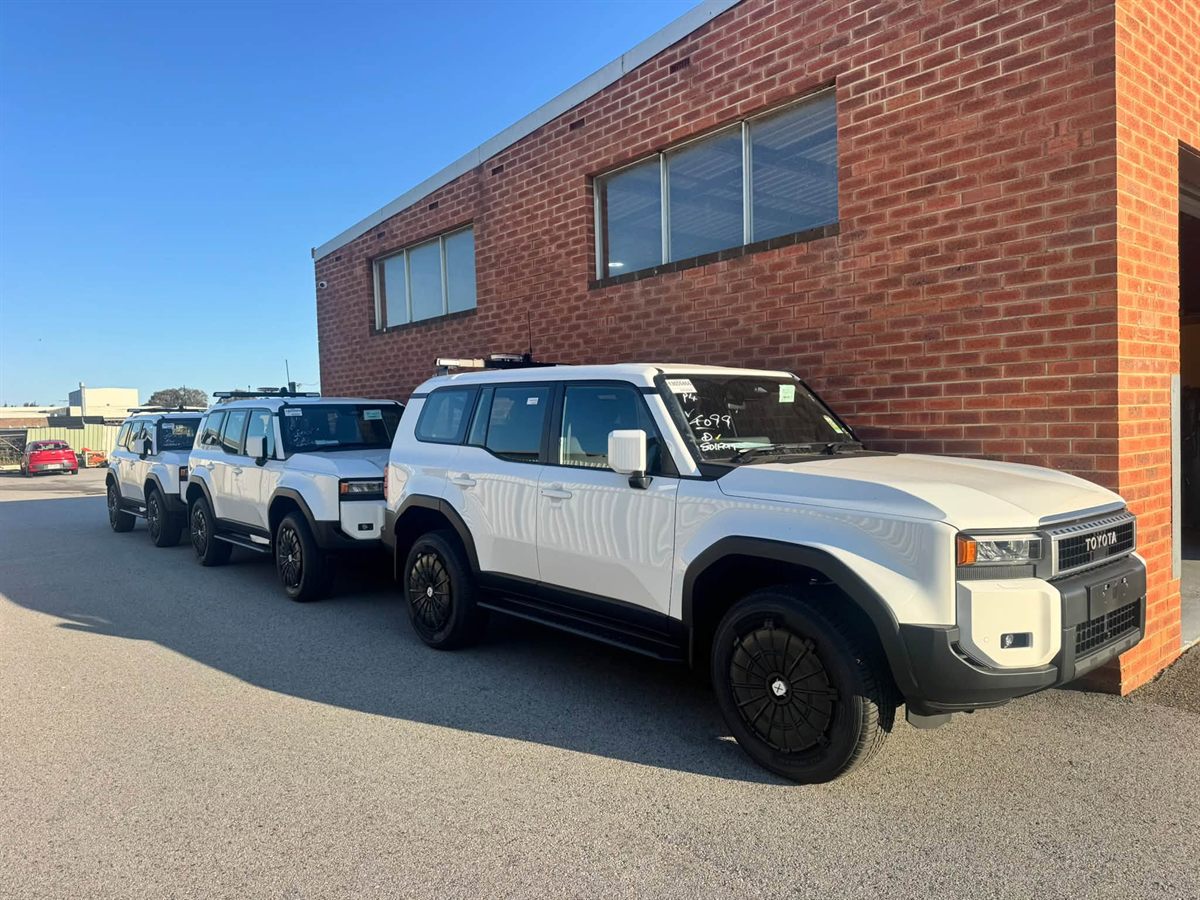 New LandCruiser Prado fleet vehicles outside the workshop