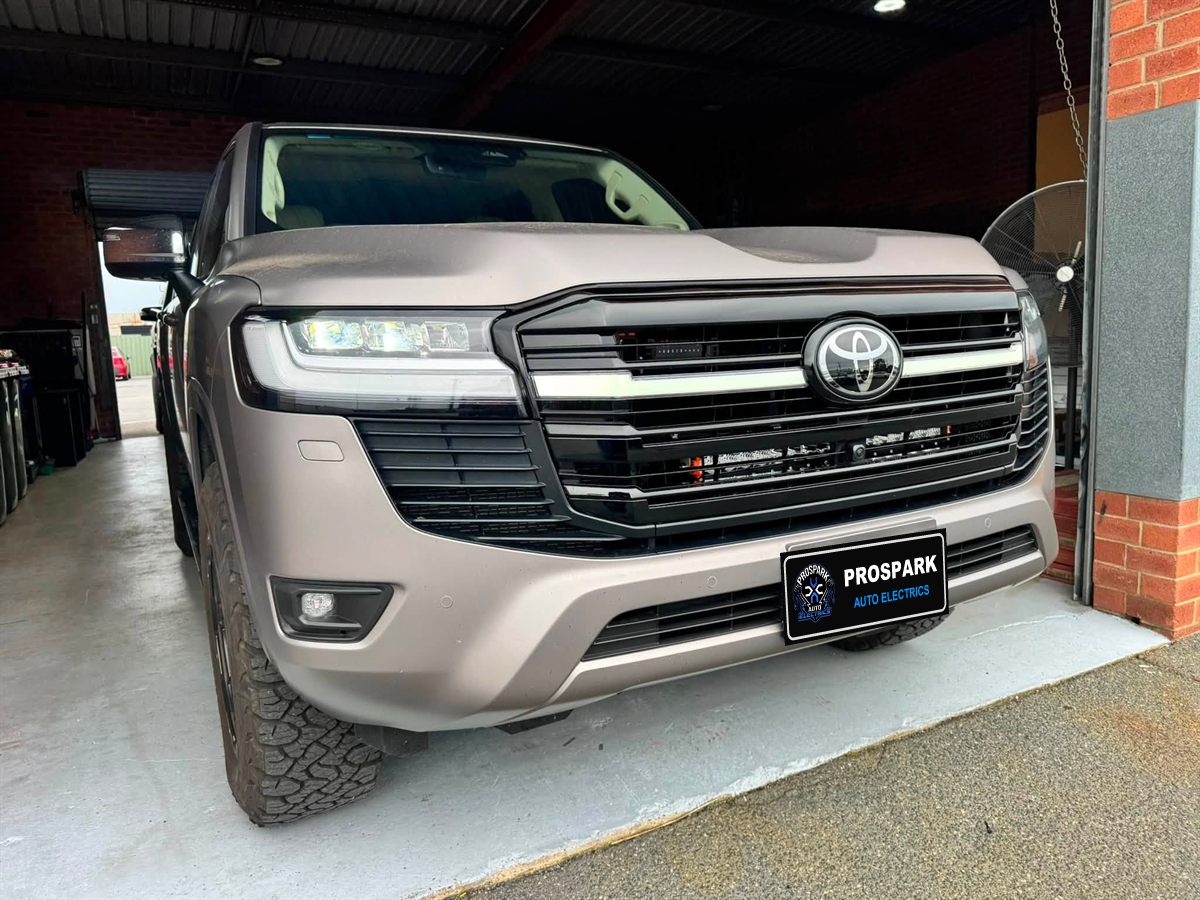 Toyota LandCruiser 300 with a behind-grille LED light bar
