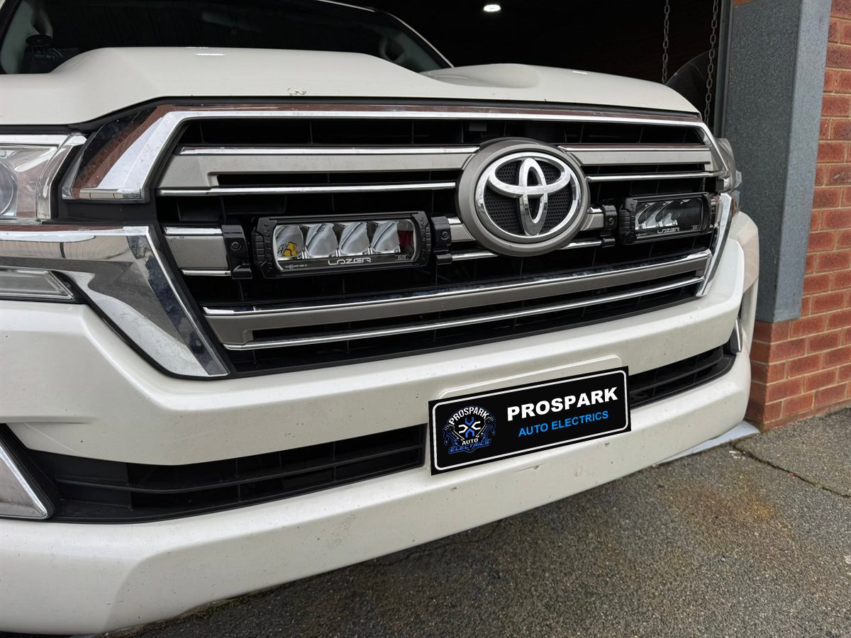 Close-up of Lazer LED grille lights on a LandCruiser 200