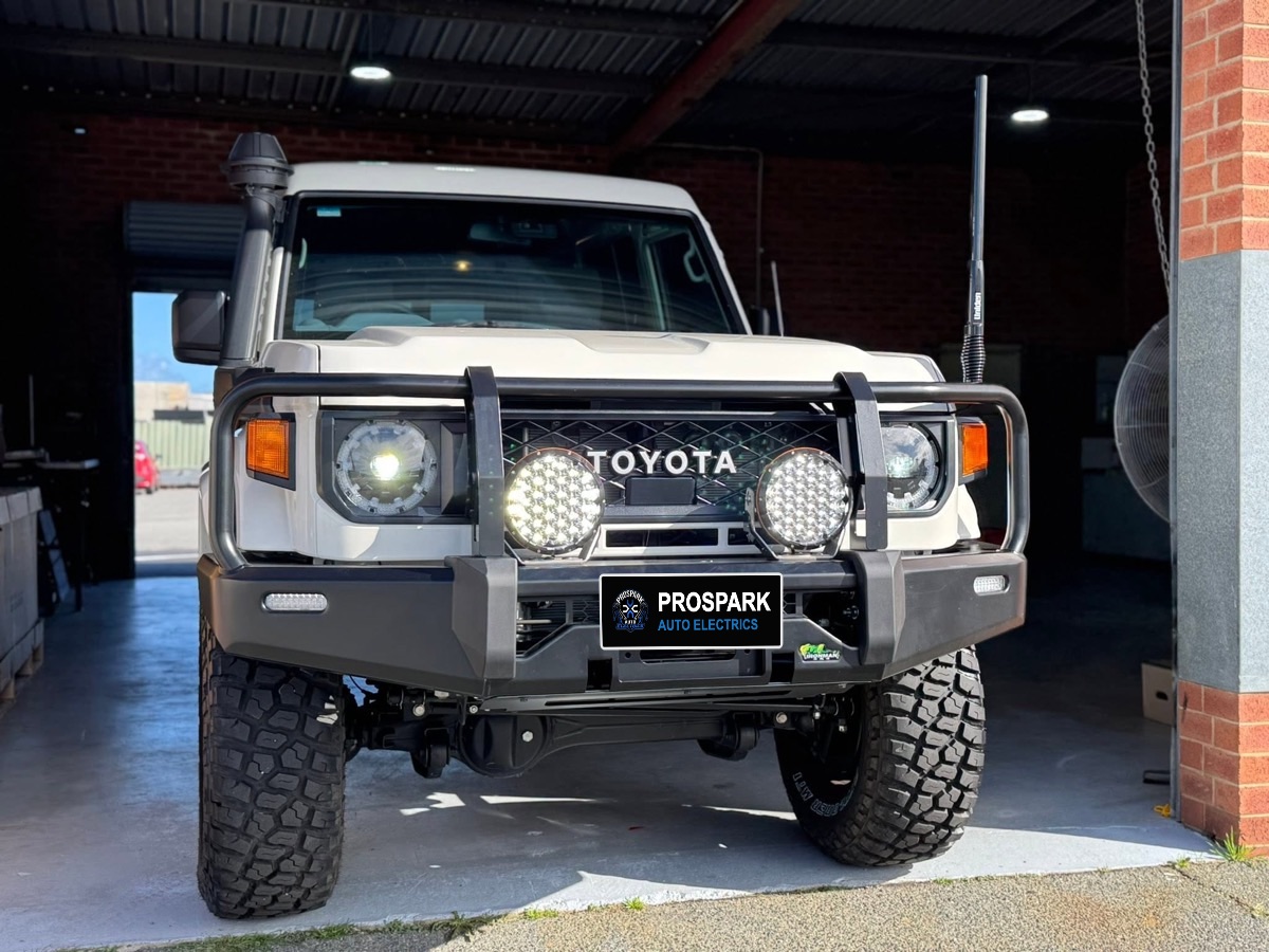 LandCruiser 70 Series with round LED driving lights on the bullbar, switched on