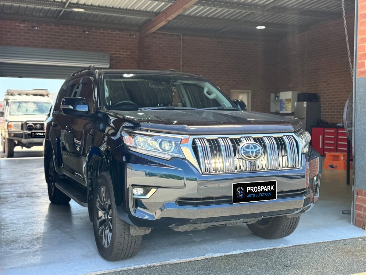 Toyota Prado with LED lights fitted behind the chrome grille, switched on