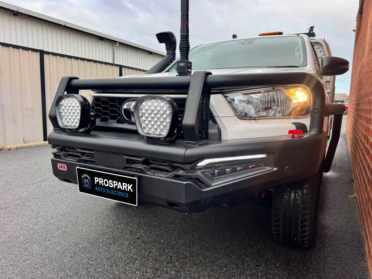 Toyota Hilux with an ARB bullbar, twin LED driving lights and a GME UHF antenna
